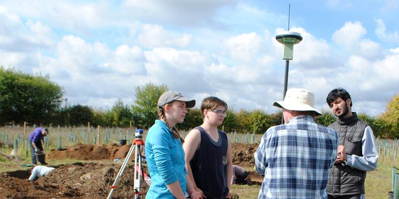 Students and volunteers learn to use a survey-grade GPS Students and volunteers learn to use a survey-grade GPS